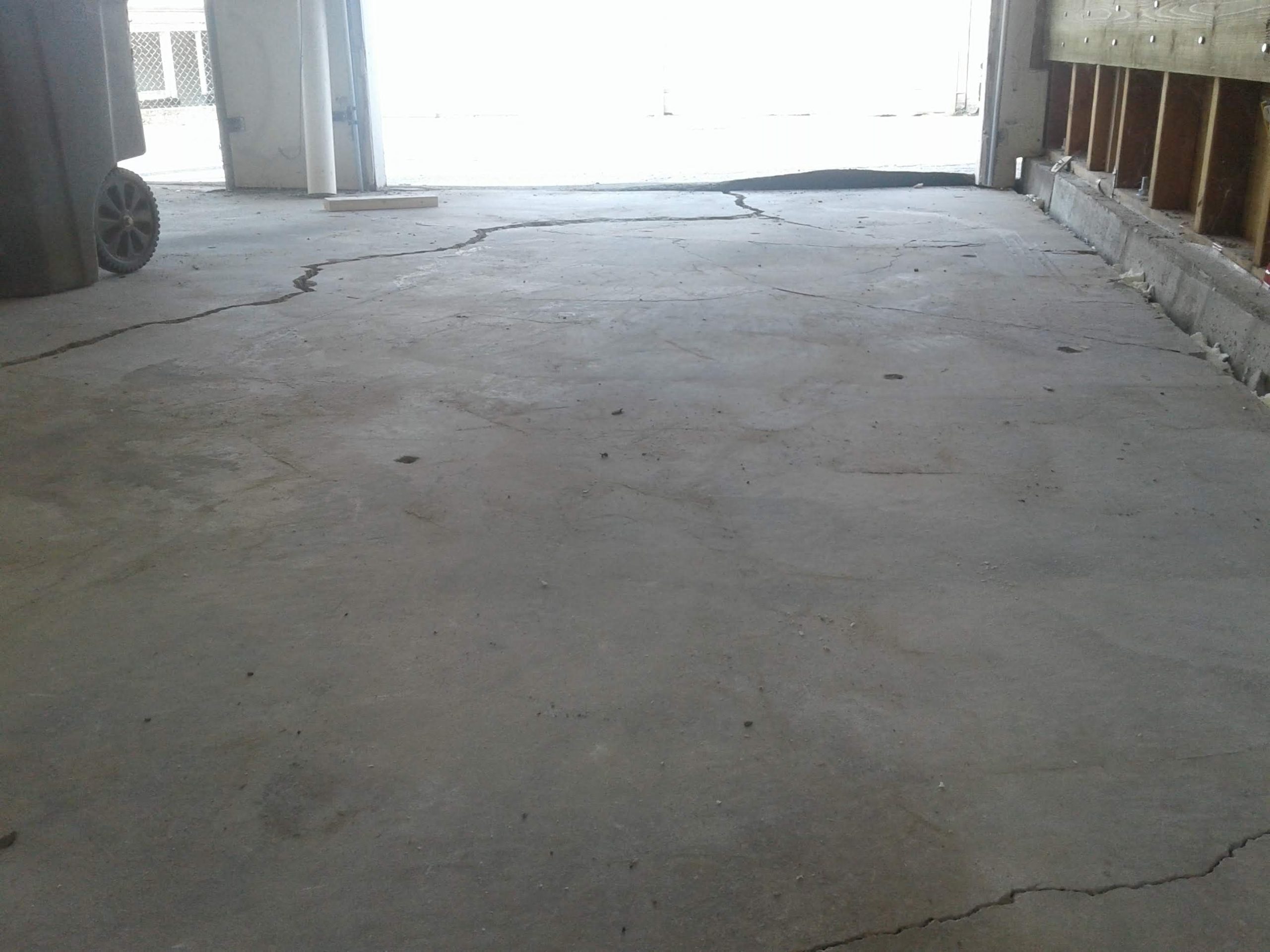 garage floor that has been repaired with concrete lifting