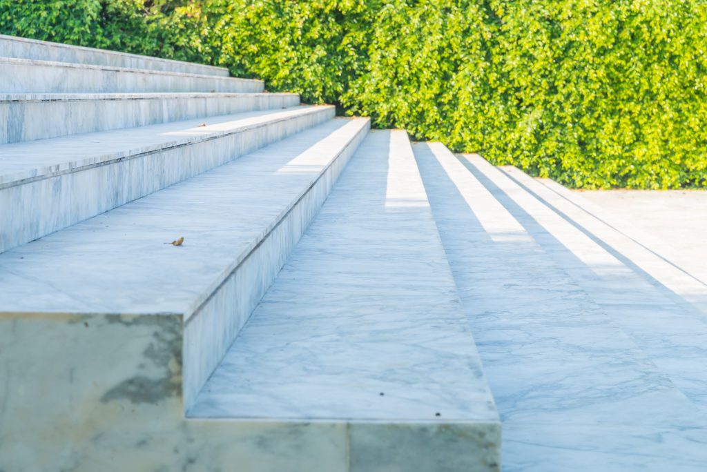 light concrete steps with a green background