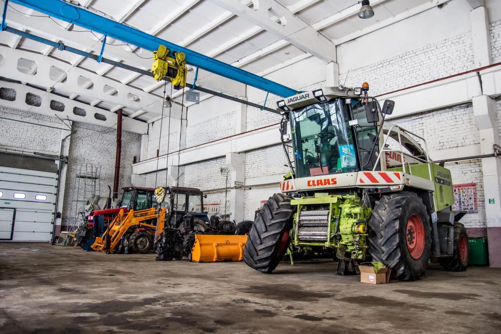 The agricultural tractors in the shop preparing for planting