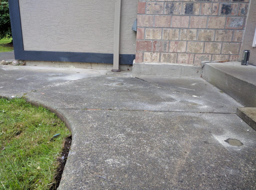 steps stairs outside door that have be lifted back to level alignment